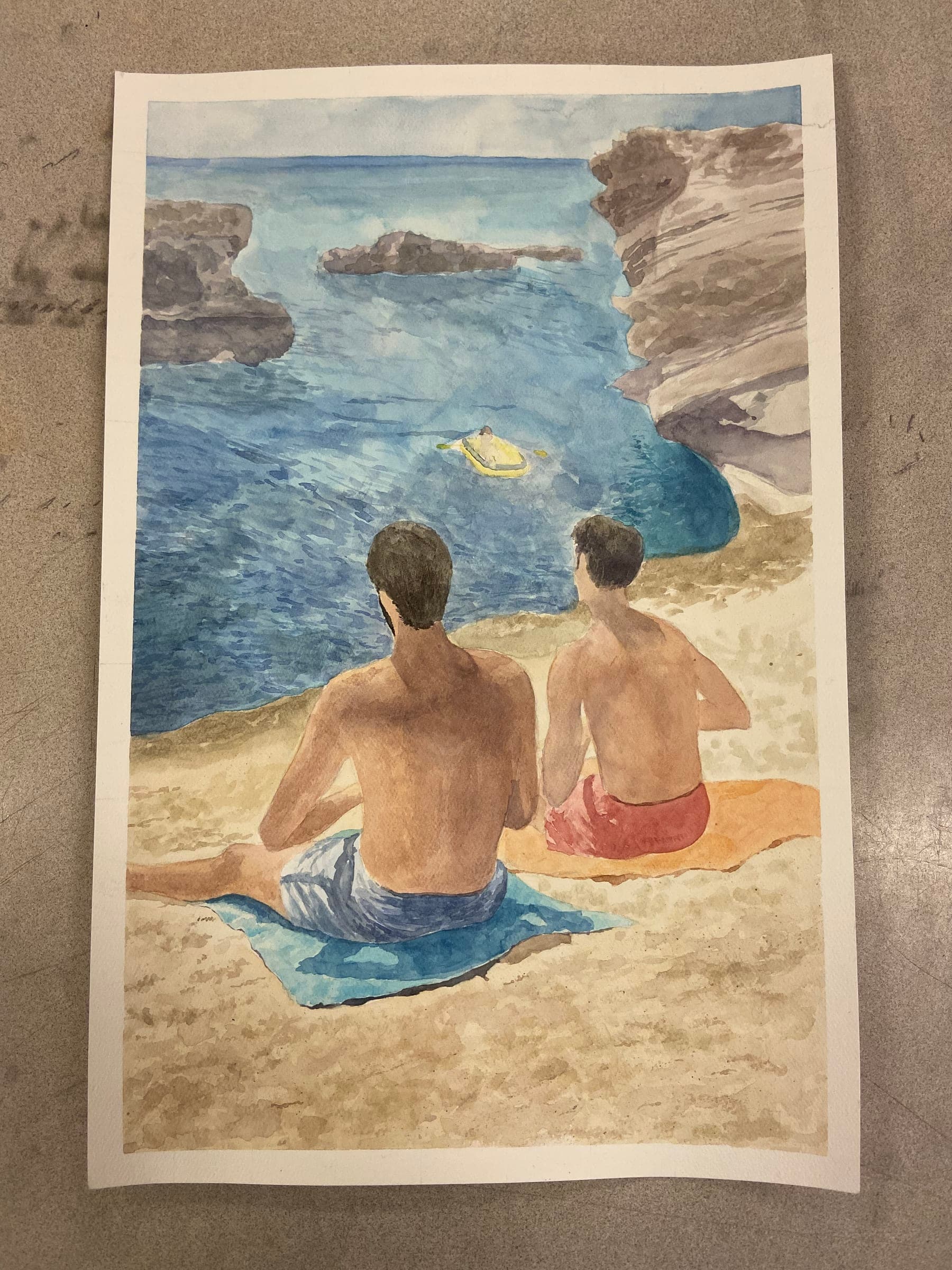 Two men sitting on the beaches of Saida, Lebanon